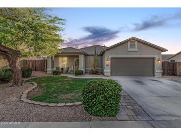 Charming single-story home with a well-manicured lawn, desert landscaping, and a two-car garage at 1508 S Danyell Pl, Chandler, AZ 85286