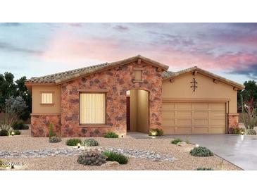 Charming single-story home featuring stone accents and a well-manicured desert landscape for inviting curb appeal at 20127 W San Miguel Ave, Litchfield Park, AZ 85340