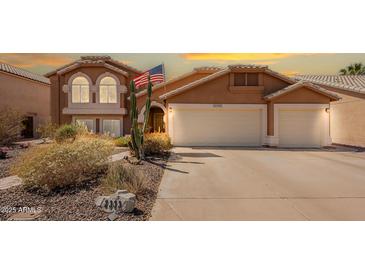Charming two-story home showcasing a well-maintained front yard and a convenient two-car garage at 2333 E Taxidea Way, Phoenix, AZ 85048