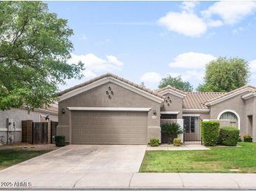 Charming single-story home featuring a well-maintained yard and an attached two-car garage at 3114 S Eugene --, Mesa, AZ 85212