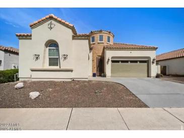 Charming single-Gathering home featuring desert landscaping, two-car garage, and barrel tile roof at 514 E Pearce Rd, Phoenix, AZ 85042