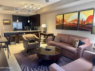 Inviting living room featuring stylish furnishings and an open floor plan with a modern kitchen at 5450 E Deer Valley Dr # 3183, Phoenix, AZ 85054