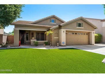 Charming single-story home featuring a well-manicured lawn and inviting curb appeal in a sunny neighborhood at 1115 E Locust Dr, Chandler, AZ 85286
