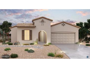 Charming single-Gathering home featuring a tile roof, neutral stucco, arched entryway, and a well-manicured desert landscape at 20111 W San Miguel Ave, Litchfield Park, AZ 85340