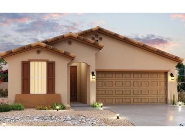 Charming single-story home featuring a tile roof, a desert-friendly front yard, and an attached two-car garage at 24134 W Hilton Ave, Buckeye, AZ 85326