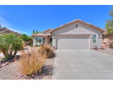 Charming single-story home with a two-car garage and desert landscaping at 67 N Montoro Ln, Casa Grande, AZ 85194