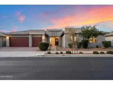 Beautiful single-story home with a three-car garage and manicured landscaping at 22842 E Via Las Brisas --, Queen Creek, AZ 85142