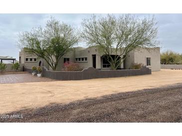 Charming home with desert landscaping and unique architectural design at 2427 W Desert Hills Estate Dr, Phoenix, AZ 85086