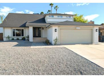 Charming single-Gathering home featuring a gravel front yard and convenient two-car garage at 4521 W Buffalo St, Chandler, AZ 85226