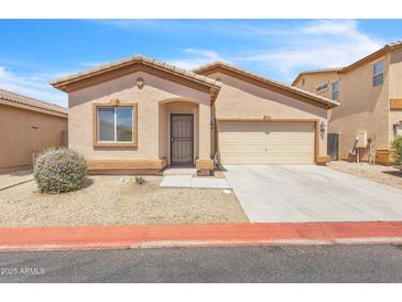 Charming single-story home with desert landscaping and a two car garage at 900 W Broadway Ave # 45, Apache Junction, AZ 85120