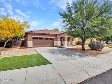 Charming single-story home features a well-manicured front yard and a two-car garage at 15216 W Westview Dr, Goodyear, AZ 85395