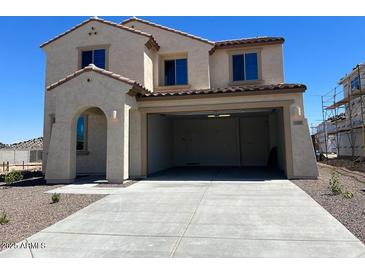Charming two-story home with a neutral-colored exterior, complemented by a spacious two car garage at 19889 W Annika Dr, Litchfield Park, AZ 85340