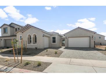 Charming single-story stucco home with a two-car garage and tiled roof at 26160 S 225Th Way, Queen Creek, AZ 85142