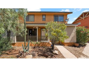 Charming two-story home featuring a welcoming porch and desert-friendly landscaping at 6448 E Paso Nuevo Dr # 101, Cave Creek, AZ 85331