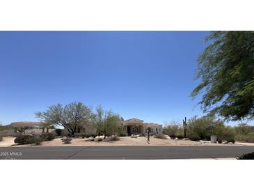 A sprawling single-story house with desert landscaping and a red tile roof at 9267 E Rimrock Dr, Scottsdale, AZ 85255