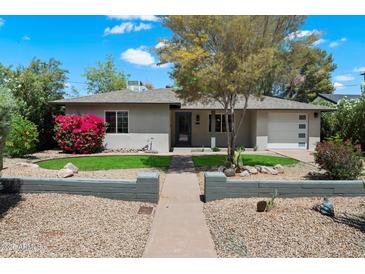 Charming single-story home featuring desert landscaping, a tidy lawn, and a welcoming walkway at 1106 W Glenrosa Ave, Phoenix, AZ 85013