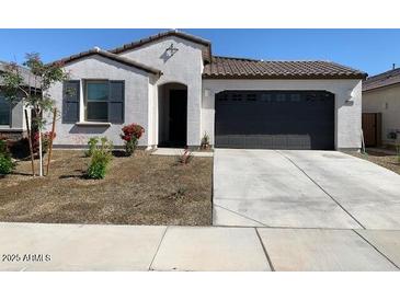 Charming single-story home with a two-car garage and low maintenance landscaping at 12316 W Wagon Wheel Dr, Glendale, AZ 85307