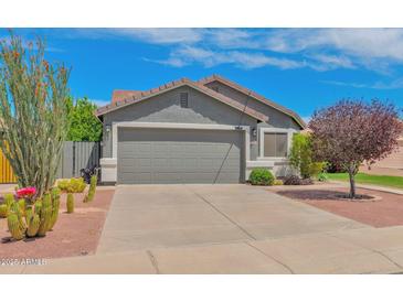Charming single story home with well-manicured xeriscaped front yard and a large two-car garage at 3284 E Sandy Way, Gilbert, AZ 85297