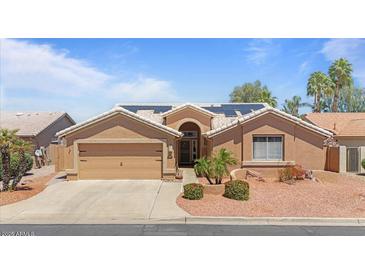 Charming single-story home with well-maintained landscaping, neutral tones, and solar panels at 15774 W Indianola Dr # Six, Goodyear, AZ 85395