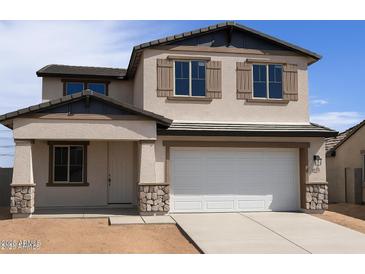 Two-story home featuring a neutral stucco exterior, two-car garage, and decorative shutters at 22368 W Monona Ln, Surprise, AZ 85387