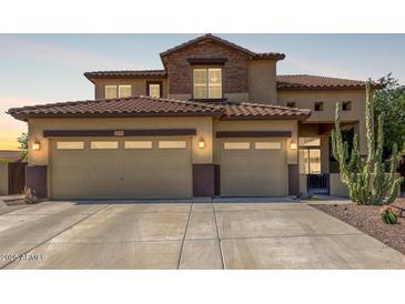 Inviting two-story home featuring a spacious three-car garage and drought-resistant landscaping at 2257 E Redwood Ct, Chandler, AZ 85286