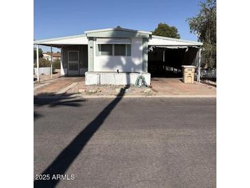 Modest manufactured home with covered parking at 2650 W Union Hills Dr # 331, Phoenix, AZ 85027