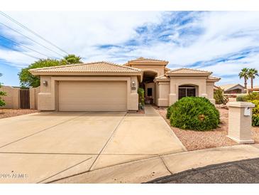 Charming single-story home with a spacious two-car garage, desert landscaping, and a neutral-toned stucco exterior at 2926 N 149Th Dr, Goodyear, AZ 85395