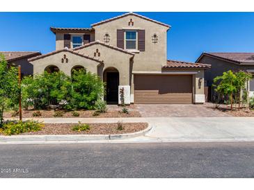Charming two-story home with a desert landscape, two-car garage and tasteful architectural details at 9548 E Rainbow Ave, Mesa, AZ 85212