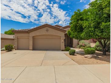 Charming single-Gathering home featuring a three-car garage and well-maintained landscaping at 22322 N 77Th St, Scottsdale, AZ 85255