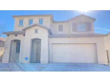 Charming two-story home with a neutral color scheme and a two car garage at 7425 W Crown King Rd, Phoenix, AZ 85043