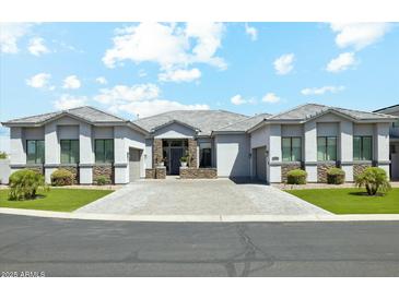 Stunning single-story home with lush landscaping, a tile roof, and a spacious driveway at 1160 E Cedar Pl, Chandler, AZ 85249