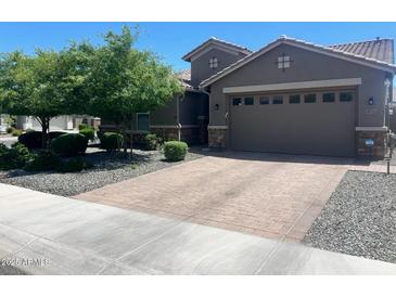Charming single-Gathering home with a well-manicured lawn and a spacious two-car garage at 18731 W San Juan Ave, Litchfield Park, AZ 85340
