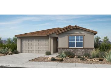 Charming single-story home featuring a two-car garage, landscaped front yard and neutral color palette at 25164 N 167Th Ave, Surprise, AZ 85387