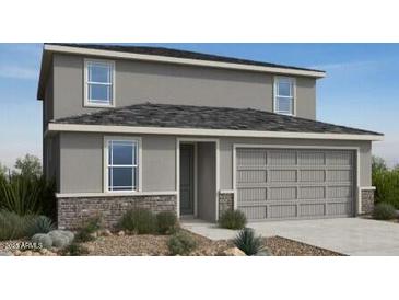 Two-story home features a two-car garage, a gray exterior, and a brick-style accent at the base of the home at 25181 N 167Th Ave, Surprise, AZ 85387