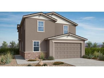 Charming two-story home with a two-car garage, featuring classic architecture and a well-maintained front yard at 25185 N 167Th Ave, Surprise, AZ 85387