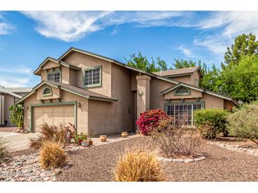 Inviting two-story home with a well-manicured, low maintenance front yard at 4062 W Cielo Grande --, Glendale, AZ 85310