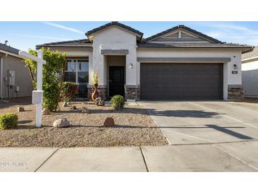 Charming single-story home featuring a low-maintenance yard and a two-car garage at 7812 W Payson Rd, Phoenix, AZ 85043