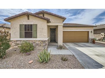 Charming single-story home with desert landscaping, stone accents, and a two-car garage at 266 N Piedra Way, Mesa, AZ 85207