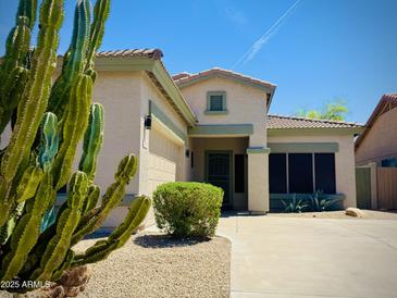 Charming single-story home featuring desert landscaping, a tile roof, and a well-maintained front yard at 7111 S 21St Dr, Phoenix, AZ 85041