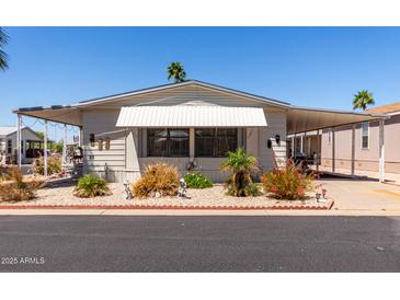 Charming single-story home with covered parking, manicured landscaping, and a cozy, welcoming facade at 9333 E University Dr # 83, Mesa, AZ 85207