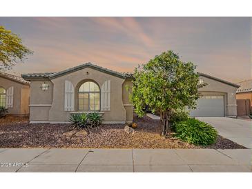 Charming single-story home featuring a well-maintained front yard and a neutral color scheme at 2323 W Kachina Trl, Phoenix, AZ 85041