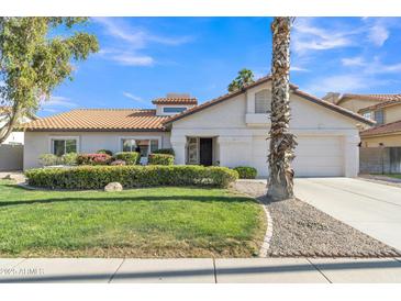 Well-maintained single-Gathering home with manicured front yard and charming curb appeal at 2333 E Egret Ct, Gilbert, AZ 85234