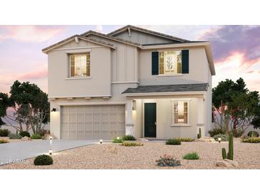 Charming two-story home with a desert landscape and a modern color palette at 18236 W Daley Ln, Surprise, AZ 85387