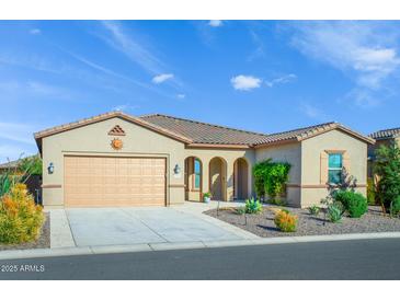 Charming single-story home featuring a low-maintenance front yard and a two-car garage at 21093 N Willow Rd, Maricopa, AZ 85138