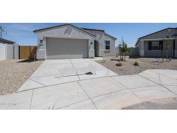 Charming single-story home featuring a two-car garage and well-maintained front yard at 22035 N Rummler Ln, Maricopa, AZ 85138