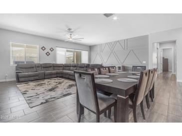 Comfortable living area with ample seating, stylish decor, and plenty of natural light at 22977 E Desert Spoon Dr, Queen Creek, AZ 85142