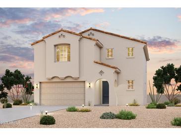 Charming two-story home with a stucco exterior, tile roof, arched entryway, and well-maintained landscaping at 2663 E Dutchmans Trl, Apache Junction, AZ 85119