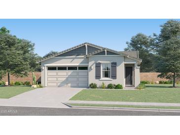 Charming single-story home with a well-manicured lawn, a two-car garage and beautiful desert landscaping at 3238 E Outlaw Ln, San Tan Valley, AZ 85140