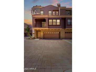 Charming townhome featuring a private balcony and a spacious two-car garage at 3935 E Rough Rider Rd # 1183, Phoenix, AZ 85050