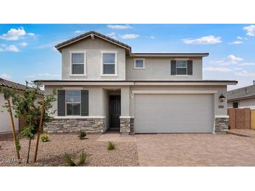Charming two-story home featuring a neutral color palette, stone accents, and an attached two-car garage at 4064 E Ghost Flower Ln, San Tan Valley, AZ 85140